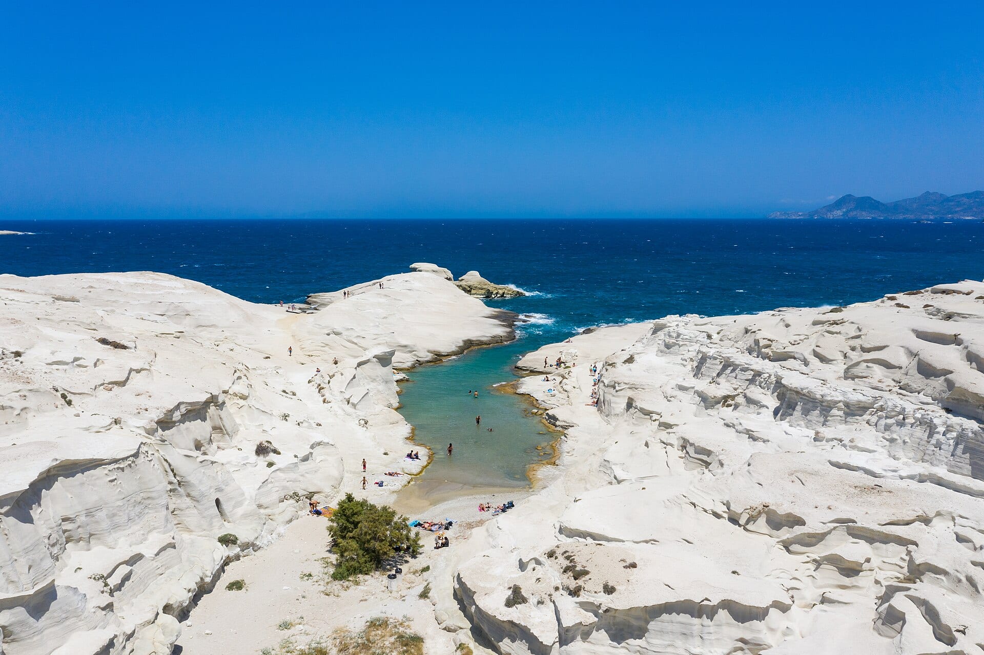 Sarakiniko’s white volcanic rock meeting the Aegean on Milos